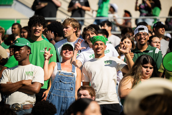 A photo focused on two students during the football game.