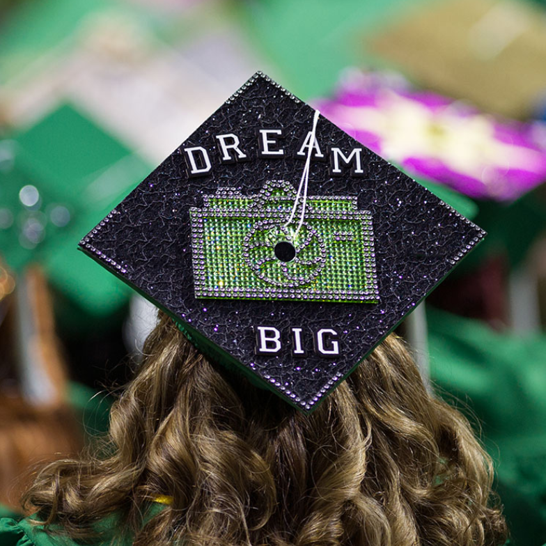 Student's Decorated Graduation Cap On Head