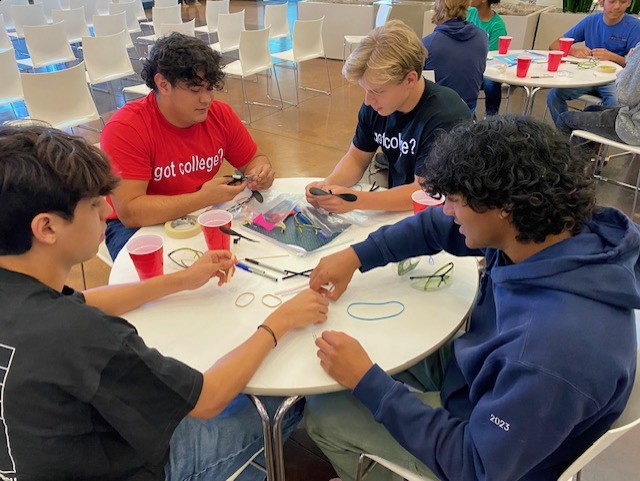 Students sitting at a table collaborating