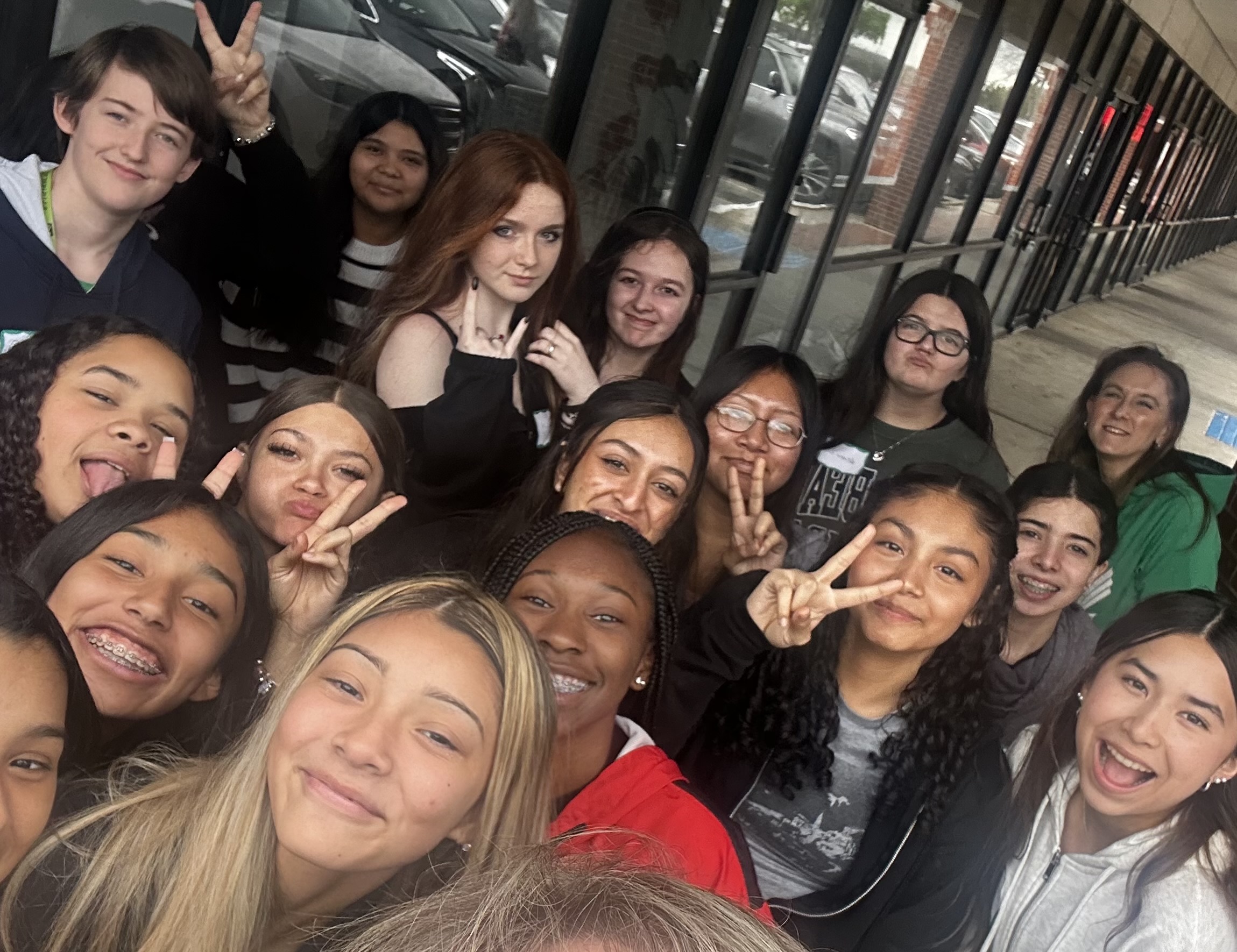 Students from Strickland Middle School take a selfie together
